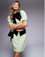 boucle and velvet miniskirt with embellished buttons and boucle and velvet puff sve top in olive